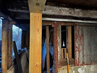 Barn renovation in progress with new structural framing